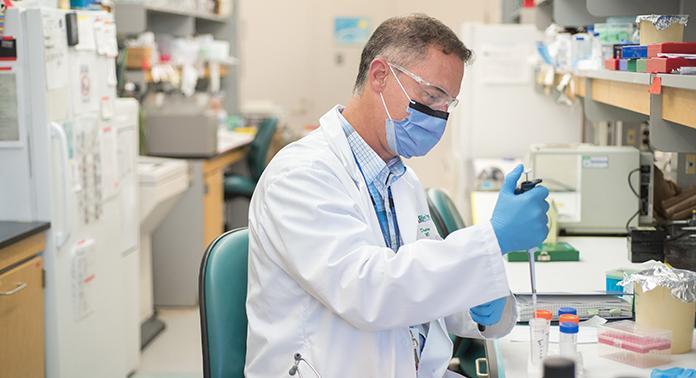 Dr. Doug Fraser works in his lab