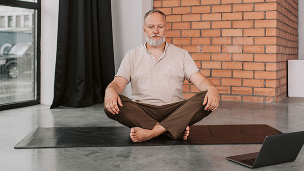 Seated man doing yoga