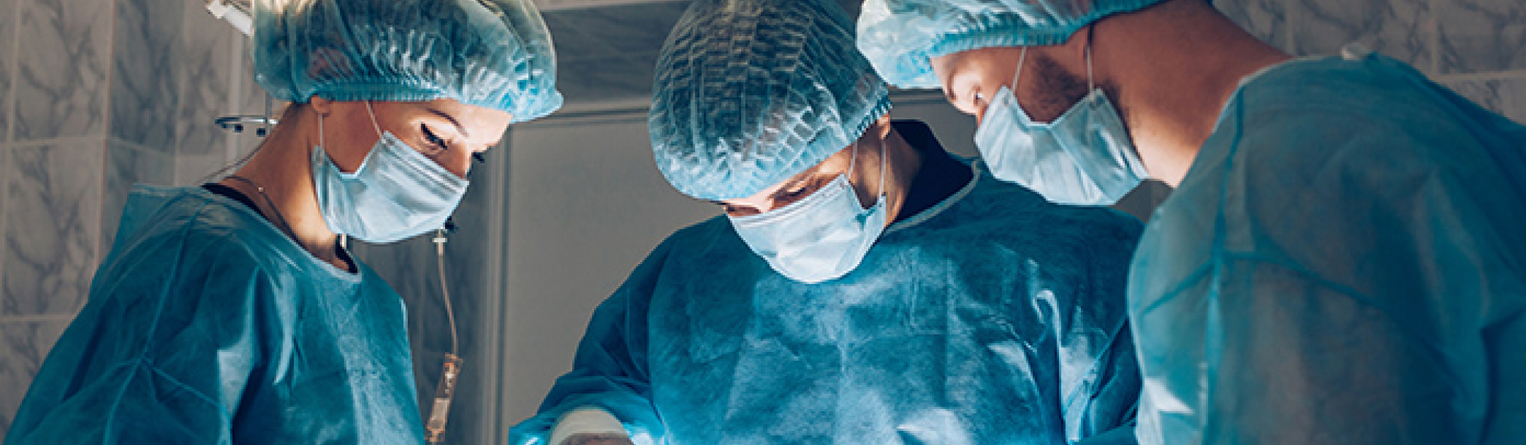 Three surgeons in an operating room
